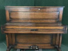 An oak cased straight strung by piano by Challoner