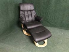A black leather relaxer chair and stool