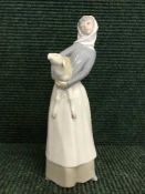 A Lladro figure - girl with lamb