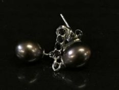 A pair of dark freshwater pearl earrings in silver mounts