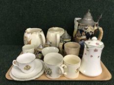 A tray of pewter lidded beer steins, commemorative jugs and mugs,
