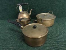 A tray of two copper lidded pans,