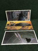 A Star Wars The Empire Strikes Back picture portfolio and two un-framed Star Trek prints