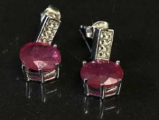 A pair of silver and synthetic ruby drop earrings