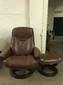A brown leather swivel relaxer chair and stool