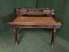 A Victorian leather topped writing desk