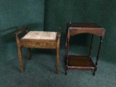An Edwardian mahogany storage piano stool together with an oak two-tier occasional table