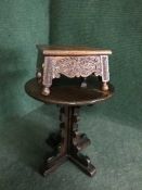 An Ercol pedestal occasional table and a carved oak footstool