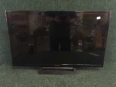A Sony 32 inch LCD TV with lead,