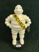 A cast metal figure - Michelin man