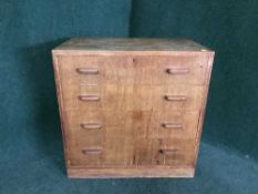 A Waring & Gillows oak four drawer chest