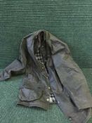 A Barbour Beaufort wax jacket,