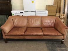 A late 20th century three seater tan leather settee