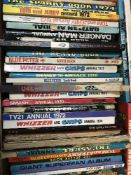 A box of annuals including Man from Uncle, Tom & Jerry,