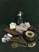 A basket of barometer, miniature wooden rowing boats, table linen, postcards,