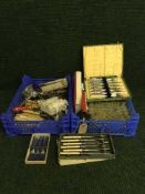 Two baskets of table cutlery,