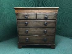 An Edwardian inlaid mahogany five drawer chest
