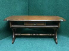 A contemporary refectory coffee table fitted a drawer