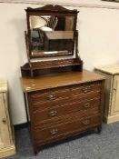 An Edwardian mahogany four drawer dressing chest