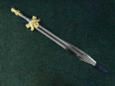 A gilt handled ornamental short sword