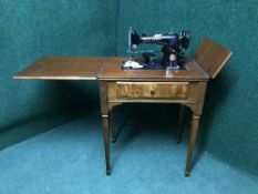 An electric sewing machine in walnut table