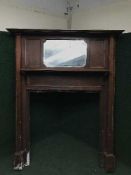 An Edwardian mirror back fire surround