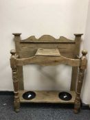 An Edwardian oak stick stand