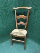 An oak rush seated country chair