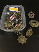 A small collection of military buttons, medal ribbon,