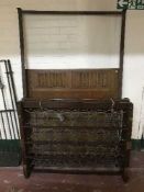 A 4' oak bed frame with metal springs