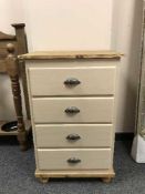 A reclaimed pine four drawer chest with iron handles