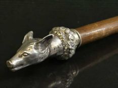 A cane mounted by solid silver cast of a fox's head inscribed Belford 26th September 1842