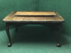 A late Victorian mahogany wind out table with leaf and handle