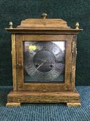 A Georgian style oak cased bracket clock