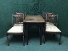 A mahogany six piece dining room suite