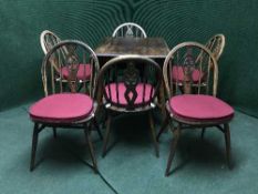 An elm drop leaf dining table and six chairs