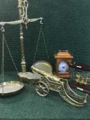 A large set of brass scales, a brass miniature cannon,