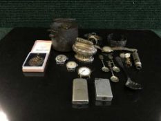 A box of silver spoon, lighters,