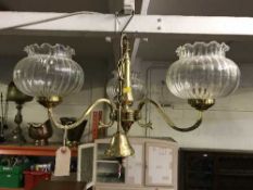 A pair of three way brass light fittings