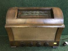 A Defiant walnut cased valve radio