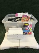 A box of Nintendo Wii and Wii fit with Playstation games