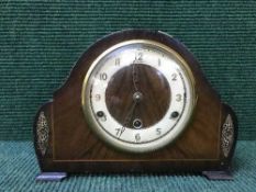 A mahogany mantle clock