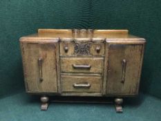 A carved oak sideboard
