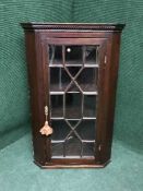 A 19th century mahogany hanging glazed door corner cupboard