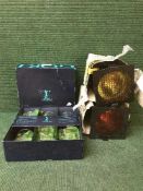 A metal side table, two theatre lights,