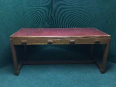 An oak leather topped library table fitted two drawers