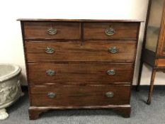 A Georgian mahogany five drawer chest on bracket feet