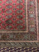 A fringed Afghan Bokhara rug 190 cm x 140 cm