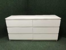 A contemporary gloss six drawer bedroom chest
