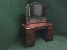 A mahogany mirror backed dressing table